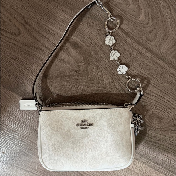 Coach Handbags - Coach White Wristlet with Floral Accents